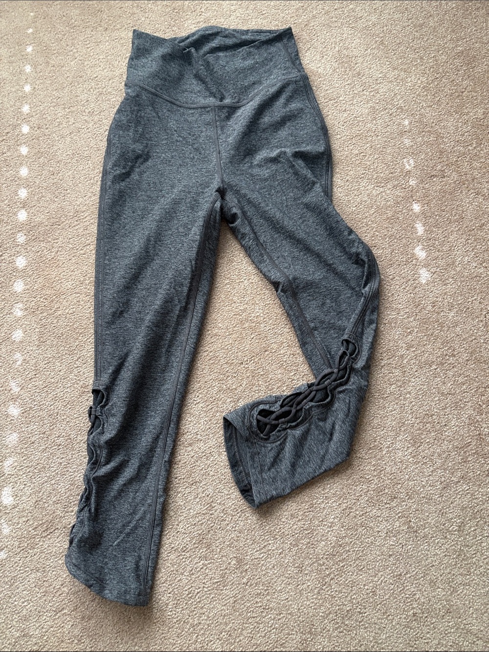 Women’s Lululemon Gray Active Leggings with Side Lattice Detail.